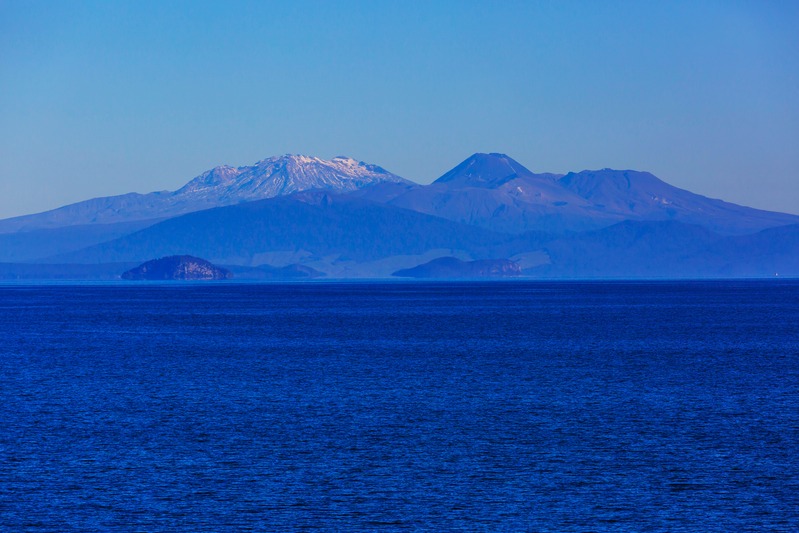 Lake Taupō and the mountains, from the original Canva design